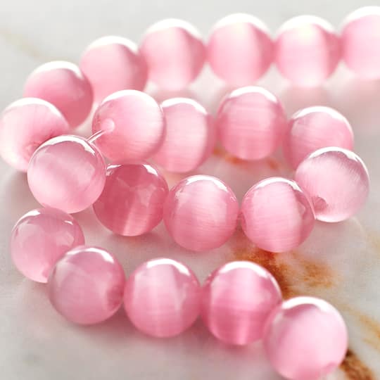 12 Pack: Pink Cat's Eye Glass Round Beads, 10mm by Bead Landing™